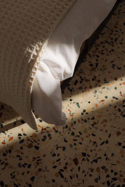 White waffle textile and terrazzo floor detail at Hotel Fragile, Ciutadella de Menorca