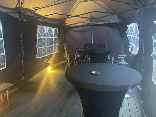 Le Bovary villa interior with round table, workspace, and patio doors at Les Gites De Flaubert, Le Héron