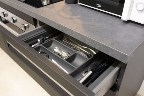 Modern kitchen drawer organizer with utensils and kitchen tools in Suite Apartment Taormina