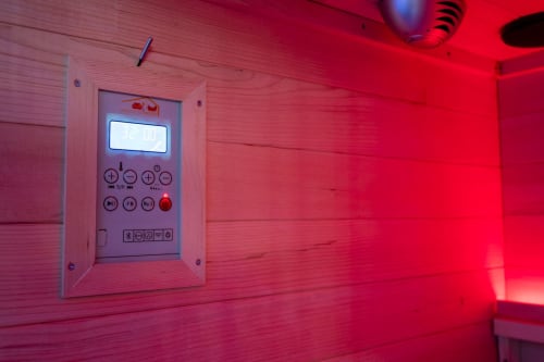 Red-lit sauna control panel with digital display and buttons in Superior Suite at Suite Apartment Taormina, Sicily