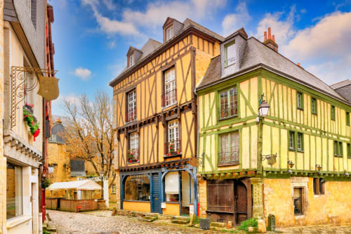 Historic half-timbered medieval buildings in Le Mans, France courtyard setting for L'escapade hotel