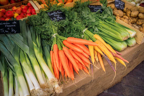 Fresh market vegetables at Sangatte farmers market including leeks, carrots, celery and potatoes