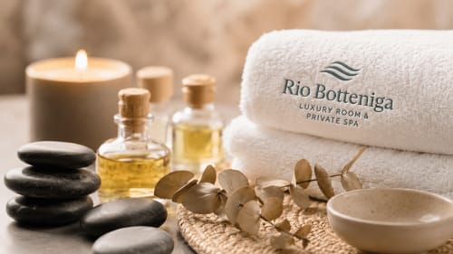 Rio Botteniga luxury spa setup with towels, oils, candles, stones and eucalyptus in Treviso