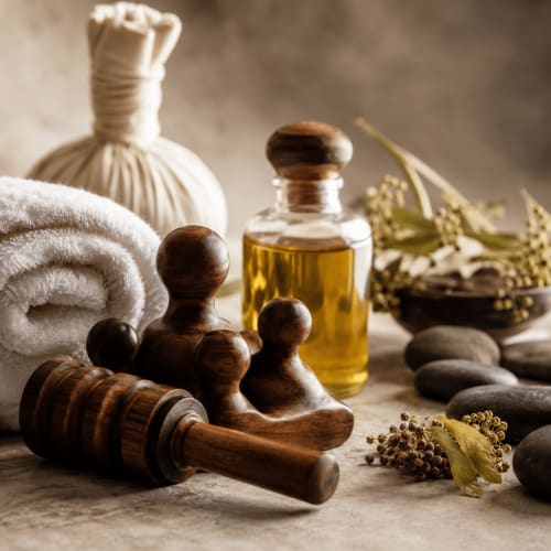 Spa massage tools with essential oil and towel at Rio Botteniga Luxury Room & Private SPA in Treviso