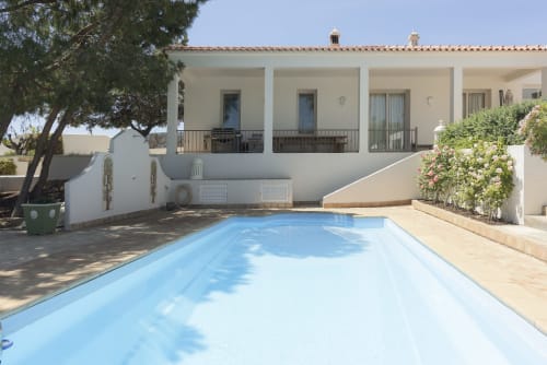 Private pool at RB Algarve villa in Boliqueime with white Mediterranean architecture and landscaped terrace