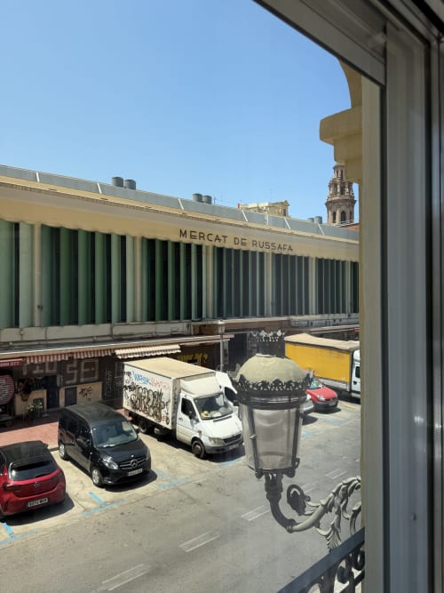 Mercat de Russafa building with parking lot and city view from Stay Gest apartment, Valencia