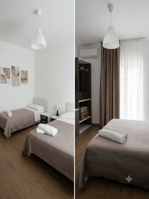 Camera tripla moderna presso Makasa B&B a Villapiana con letti gemelli, lampade a sospensione bianche e vista giardino attraverso terracotta