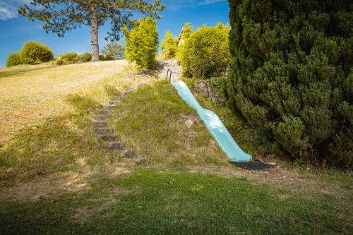 Rustic slide in Giverny countryside garden at Le Paradis de Lucile, La Roche Guyon