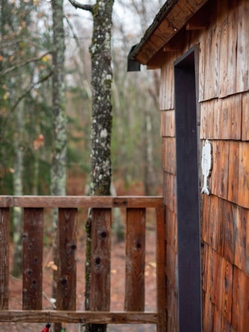 Rustic wooden cottage with garden view at Les Murmures du Bois, a French bed & breakfast nestled among trees