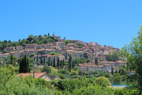 Hilltop village of Cagnes-sur-Mer with terracotta roofs, cypress trees, and Mediterranean architecture near STAYnGOLF bed and
