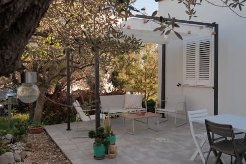 Casa Verde Oliva apartment terrace at WelcHome, Rocca San Giovanni with pergola, olive trees, and lounge seating