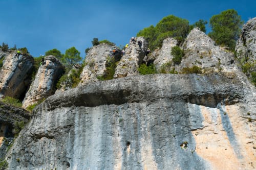 Rock climbers on limestone cliffs near Puget-Théniers, France