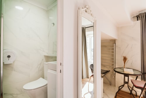 Modern bathroom with marble shower and toilet at Charme da Graça hotel, Lisboa