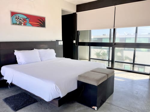 Modern king bedroom at Vidasoul BnB in La Vinorama with sea view, white linens, black furniture