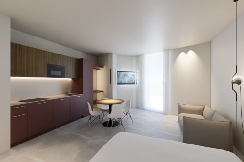 Monolocale moderno a Pesaro con cucina attrezzata, zona pranzo e area salotto