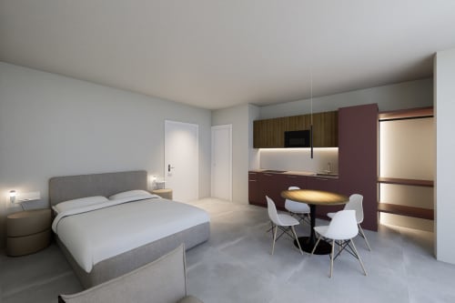 Moderno monolocale con vista mare a Riviera Apartments a Pesaro con letto, angolo cottura, zona pranzo e