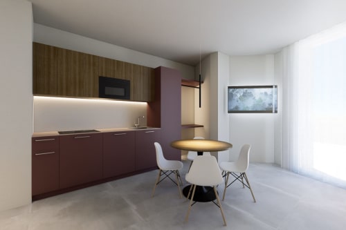 Monolocale moderno alle Riviera Apartments Pesaro con cucina attrezzata, tavolo da pranzo rotondo e vista mare dal balcone