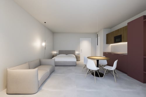 Moderno monolocale alle Riviera Apartments a Pesaro con vista mare, letto, angolo cottura, zona pranzo e soggiorno