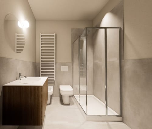 Bagno moderno presso Riviera Apartments a Pesaro con lavandino, toilette e doccia con box in vetro e portasciugamani