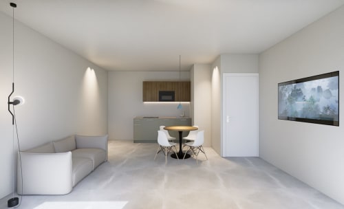 Moderno monolocale alle Riviera Apartments a Pesaro con zona giorno, angolo cottura, tavolo da pranzo, divano e elementi a muro