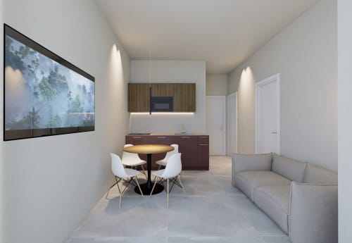 Moderno bilocale presso Riviera Apartments a Pesaro con cucina attrezzata, zona pranzo, divano e TV a parete.