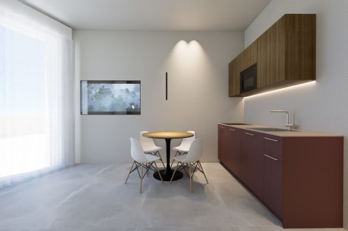 Cucina moderna e zona pranzo a Riviera Apartments, Pesaro con angolo cottura attrezzato e tavolo rotondo