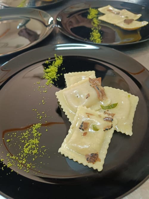 Elegant plated pasta with pistachio garnish at Hotel Ristorante alle Querce, Castelbuono