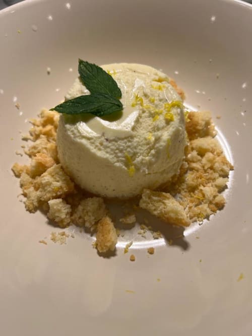 Pistachio ice cream scoop with mint on crumb crust at Hotel Ristorante alle Querce, Castelbuono