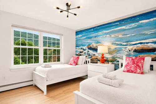Bright mountain view bedroom at Malkita Aria villa in Woodbury with two beds, ocean mural, pink pillows, and floor-to-ceiling