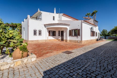 White Mediterranean villa with terracotta patio and garden, Quinta do Águas in Lagoa, Portugal