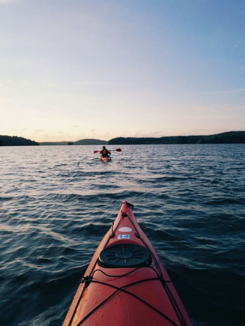 Kayaking on scenic lake with forested hills, Aldea Rural Pazos De Arenteiro