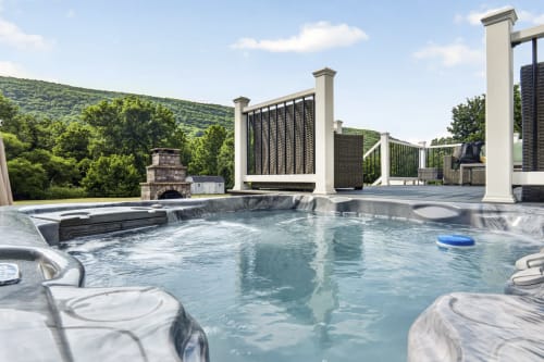 Luxury mountain view infinity pool at Malkita Aria villa in Woodbury with hot tub and modern outdoor entertaining space