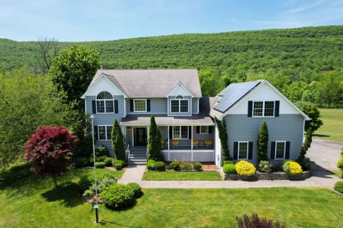 Malkita Aria Mountainview Retreat villa in Woodbury with modern architecture, mountain views, manicured landscape, and