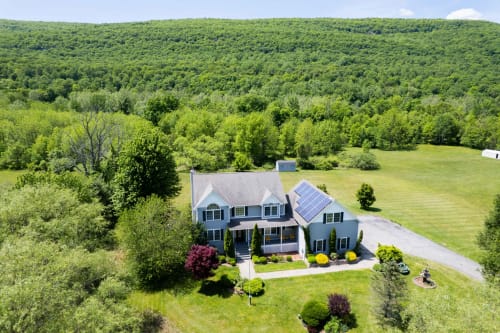Malkita Aria Mountainview Retreat villa in Woodbury with solar panels, private backyard, and mountain forest views