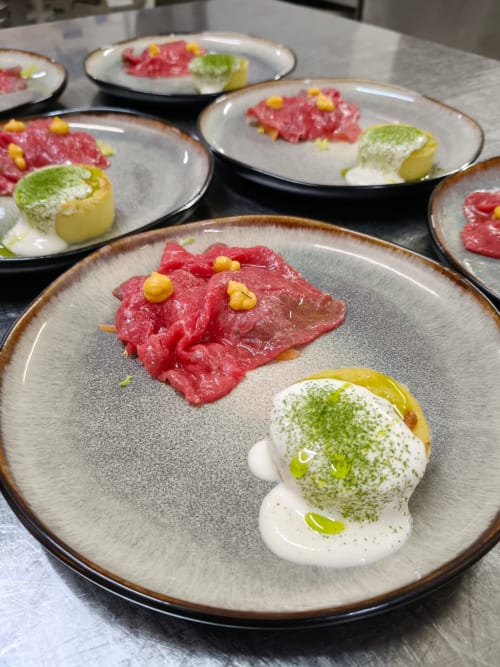 Fine dining plated dishes at Hotel Ristorante alle Querce in Castelbuono featuring cured meat and pistachio cream