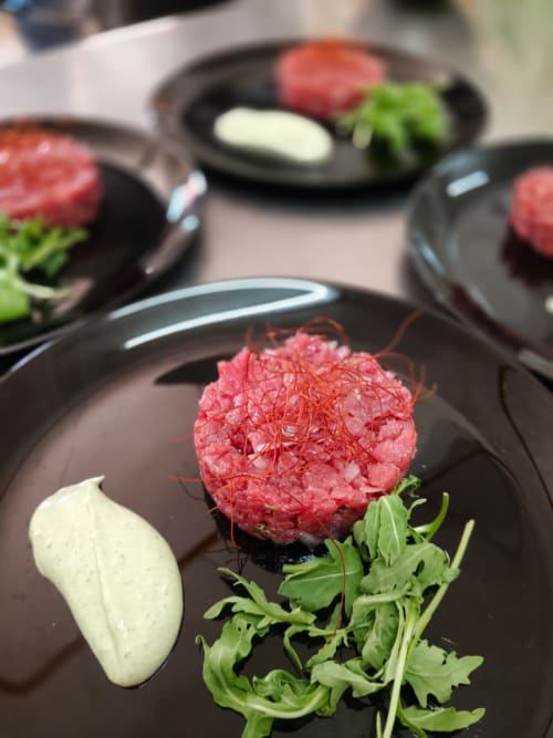 Gourmet beef tartare with fresh greens and saffron at Hotel Ristorante alle Querce, Castelbuono