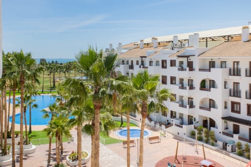 Haus Holiday Homes apartment with pool, palm trees, and sea views in San Pedro del Pinatar, Spain