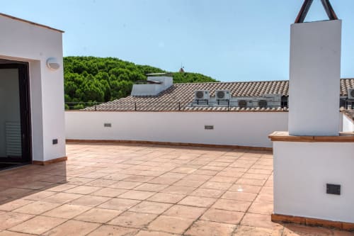 Spacious rooftop terrace at Finques Garcia Enrich apartment in Palafrugell with tiled flooring and sea views