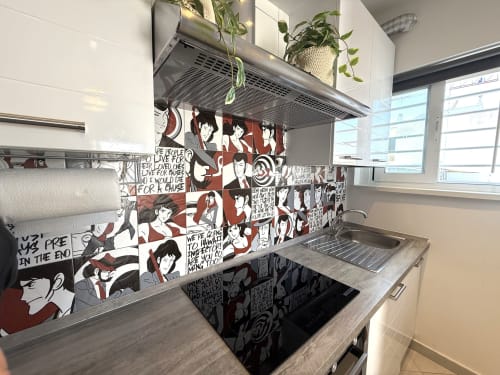 Cucina moderna in Appartamenti Bari con rivestimento a tema anime, elettrodomestici in acciaio inox e vista sulla città