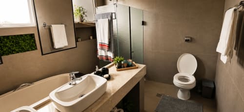 Banheiro moderno do apartamento CSS em Maringá com pia, vaso sanitário, chuveiro, toalheiro e plantas decorativas