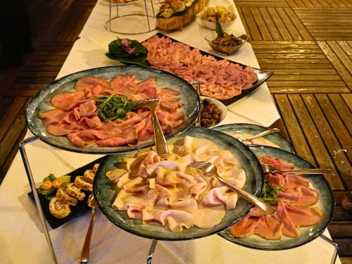 Elegant charcuterie and cured meat spread at Hotel Ristorante alle Querce in Castelbuono, Italy