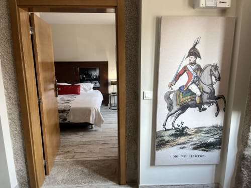 Wellington room entrance at RISOTURISMO with period-style decor and historical cavalry portrait on wall