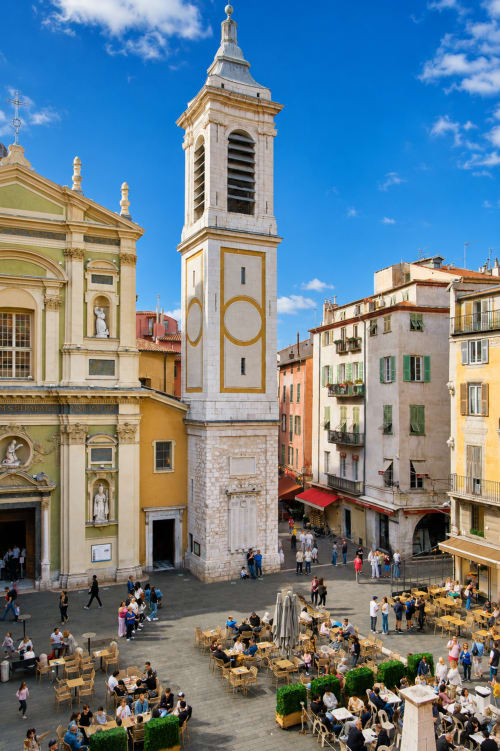 Rossetti Square in Nice, France with bell tower, colorful buildings, and outdoor café seating overlooking historic landmark