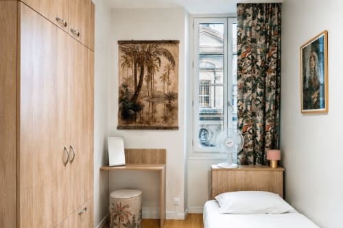 Le Rossetti apartment at Enjoy Nice with wooden wardrobe, desk, white bed, and window view of Nice landmarks