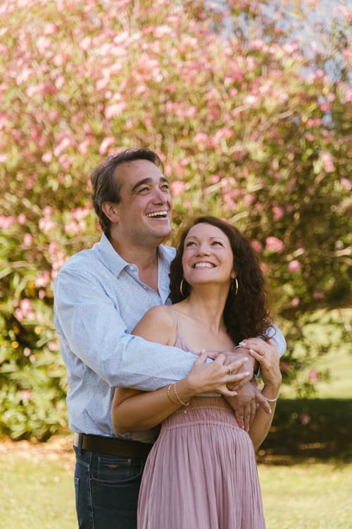 Couple smiling in blooming flower garden at Mas des Ecoliers, Provence bed and breakfast in Chateaurenard, France