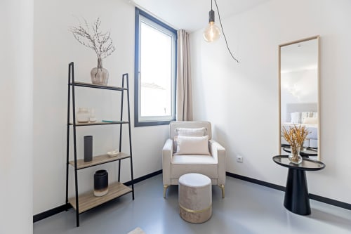 Modern Superior Studio at Benefit Collection Porto with minimalist decor, comfortable armchair, and garden view