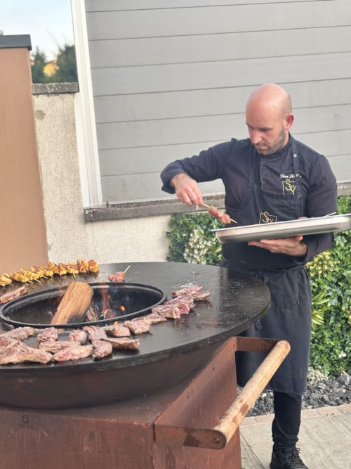 Chef grilling meat at Hôtel-Restaurant le S'Y in Seingbouse, France