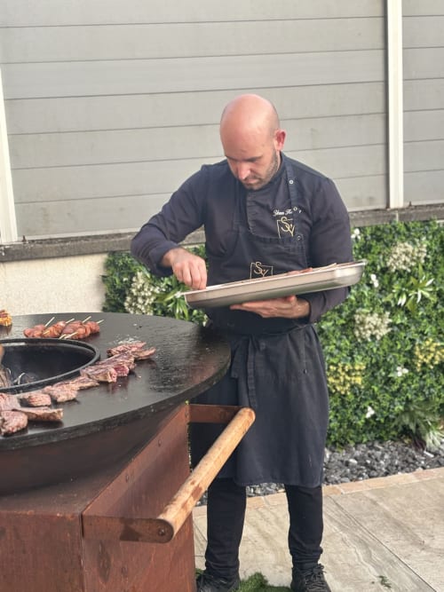 Chef grilling meat at Hôtel-Restaurant le S'Y in Seingbouse, France