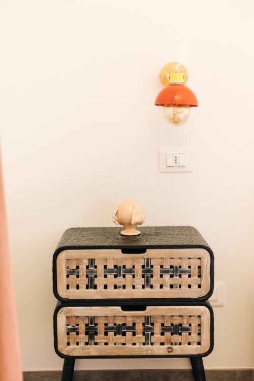 Modern wooden dresser with woven rattan drawers and decorative mushroom lamp at Tenuta Fascianello, Fasano