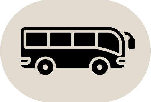 Icona di autobus nera su sfondo beige per il servizio navetta dell'hotel Casa Azcona a Zizur Mayor